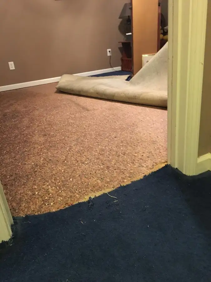 Carpet pad removal revealing water damage during Water Mitigation Services in Mission Viejo