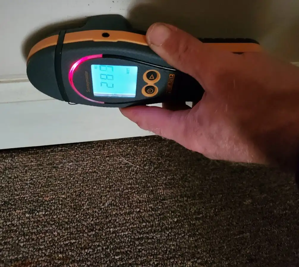 Moisture detection at baseboard during Storm Damage Restoration in Mission Viejo